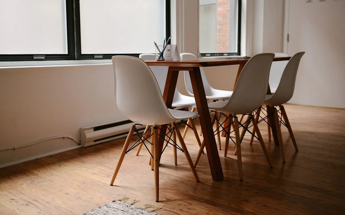Empty meeting room with chairs around a table