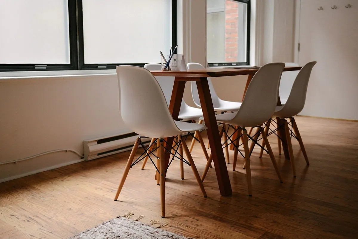 Empty meeting room with chairs around a table